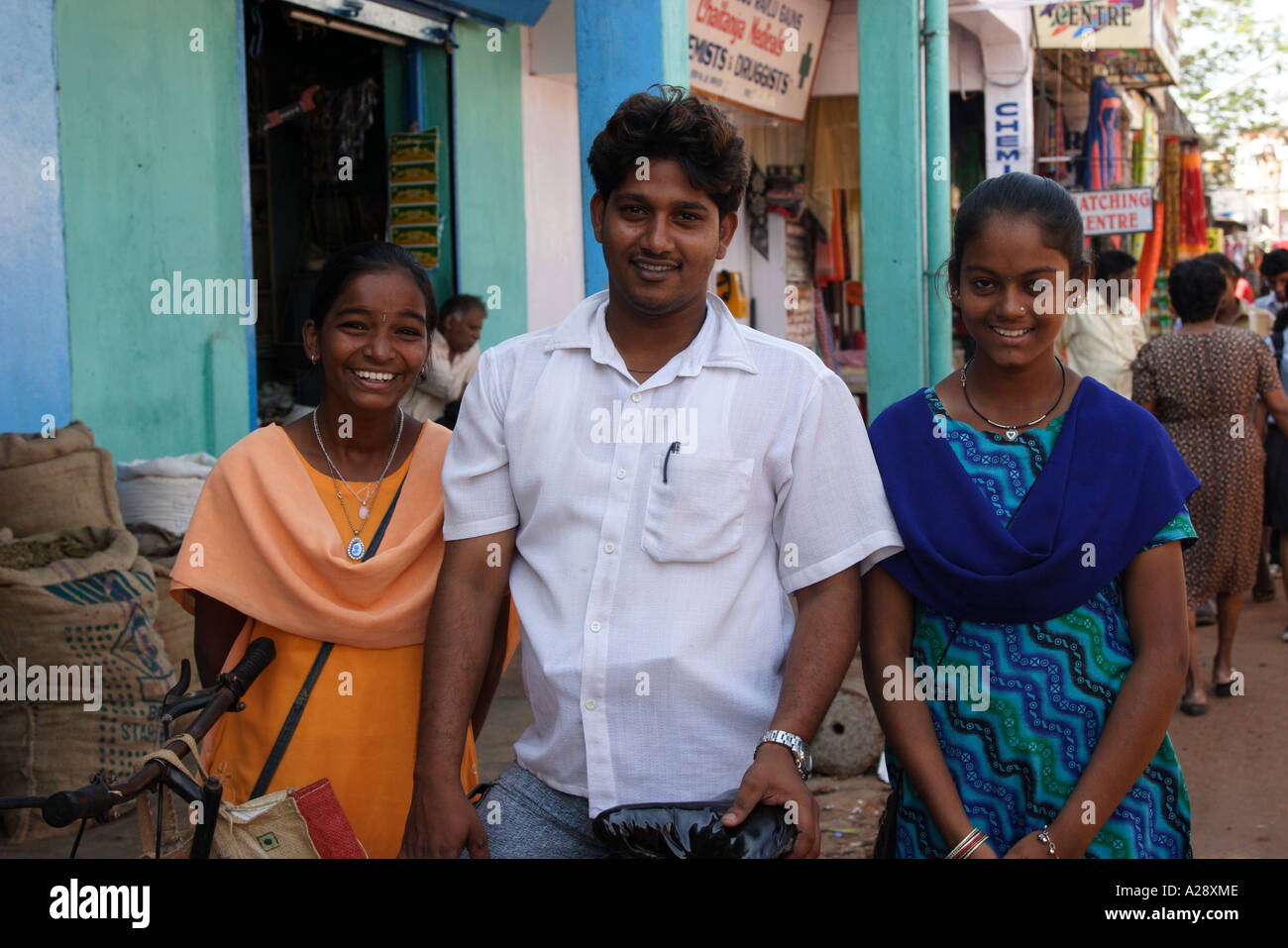 Young Man With his two sisters Mapusa City Goa India Stock Photo