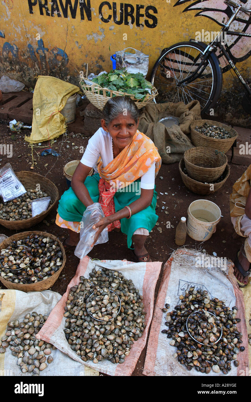 Market trader selling fresh shell fish Mapusa city Goa India Stock ...