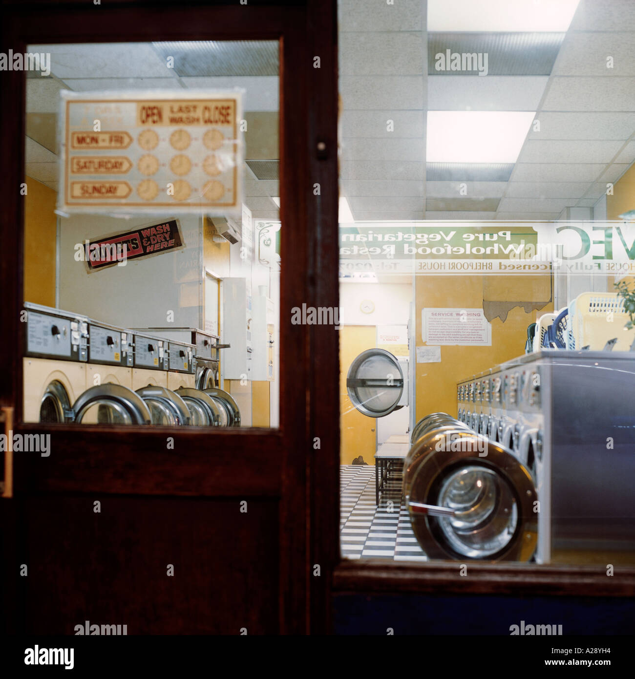viw through window of north London  launderette at night after closing Stock Photo