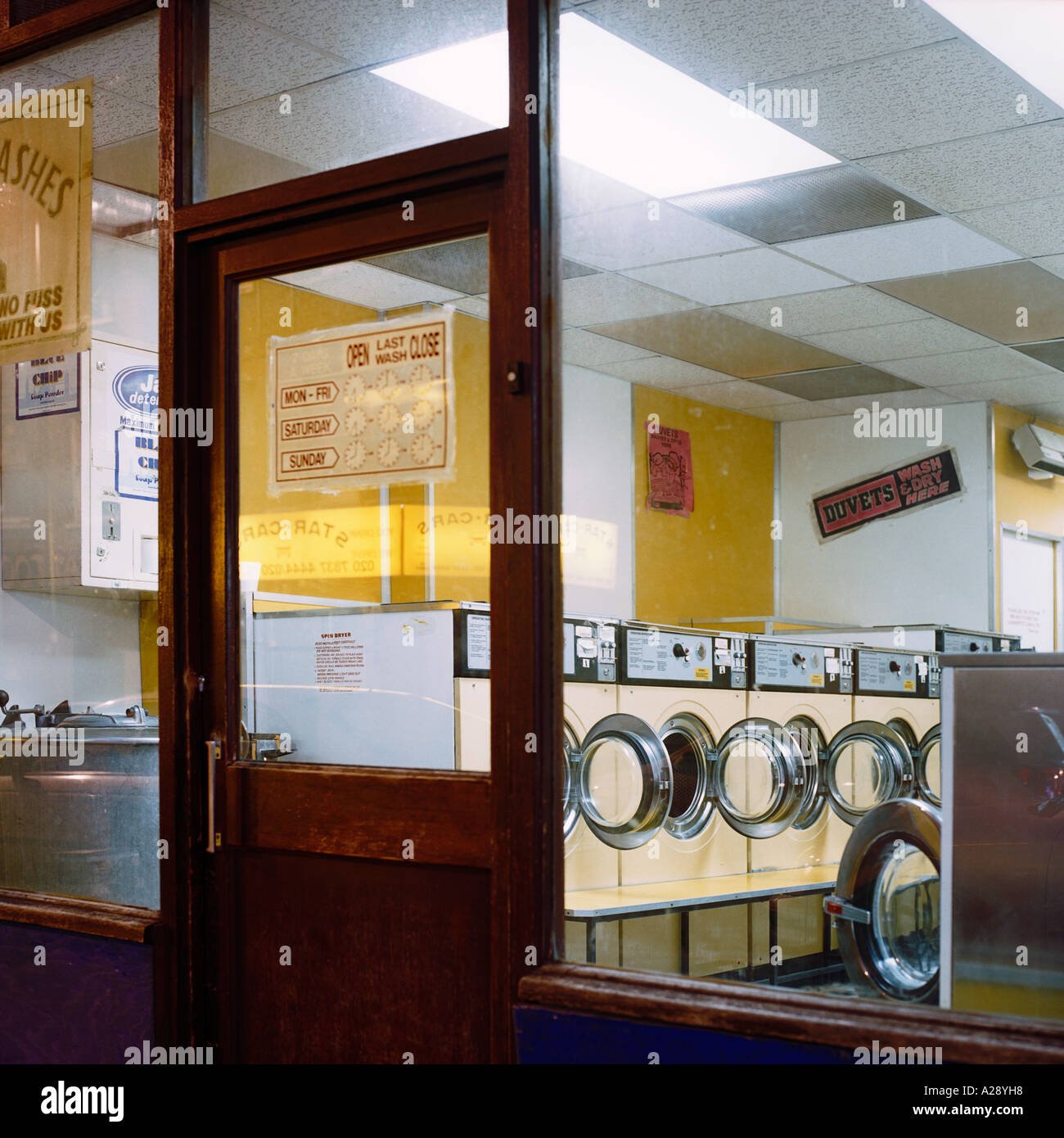view through window of north London  launderette at night after closing Stock Photo