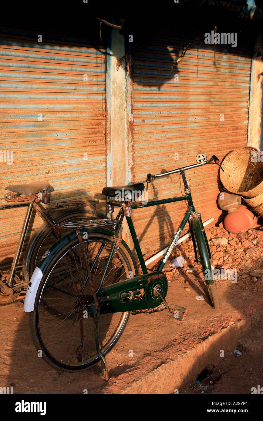 Old Bike & Sandy Wall Mapusa City Goa India Stock Photo