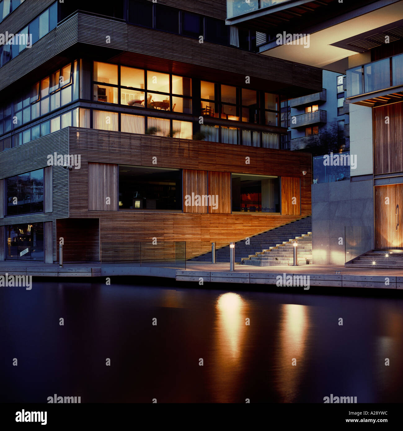 dusk shot of Gainsborough Studios apartment block, north London, inc  reflections in Regent's Canal Stock Photo