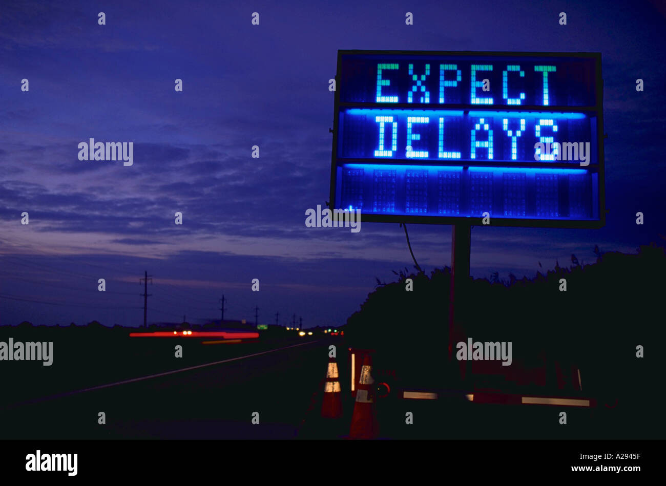 Expect Delays mobile programmable traffic sign at twilight Concept Real Life Stock Photo