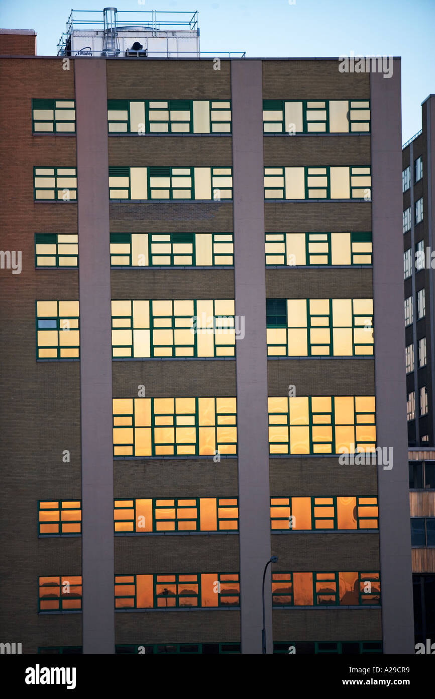 BUILDING WITH SUNSET IN REFLECTING IN WINDOWS Stock Photo - Alamy