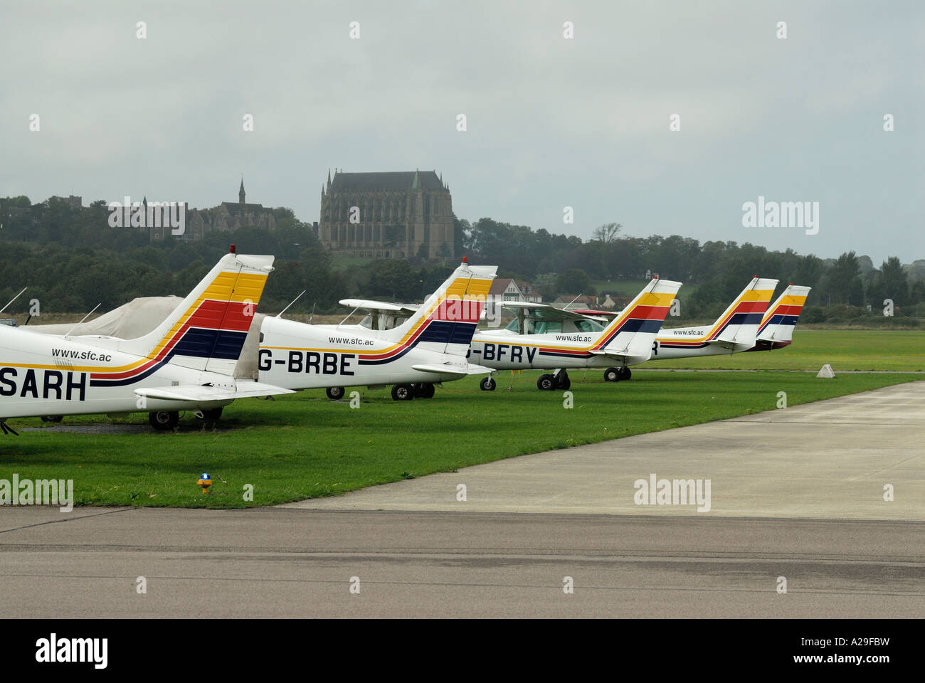 A row of aircraft tails at Shoreham Airport Lancing College in background Stock Photo