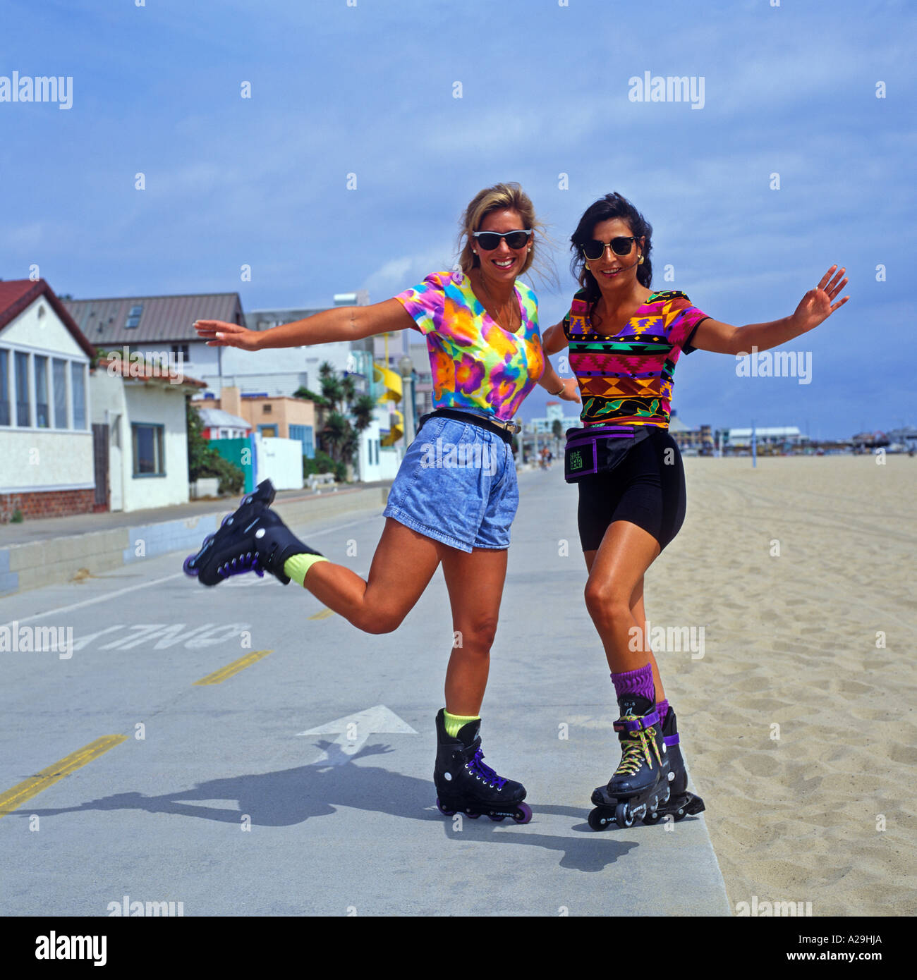 TWO FEMALE ROLLERBLADERS AT SANTA MONICA BEACH CALIFORNIA Stock Photo
