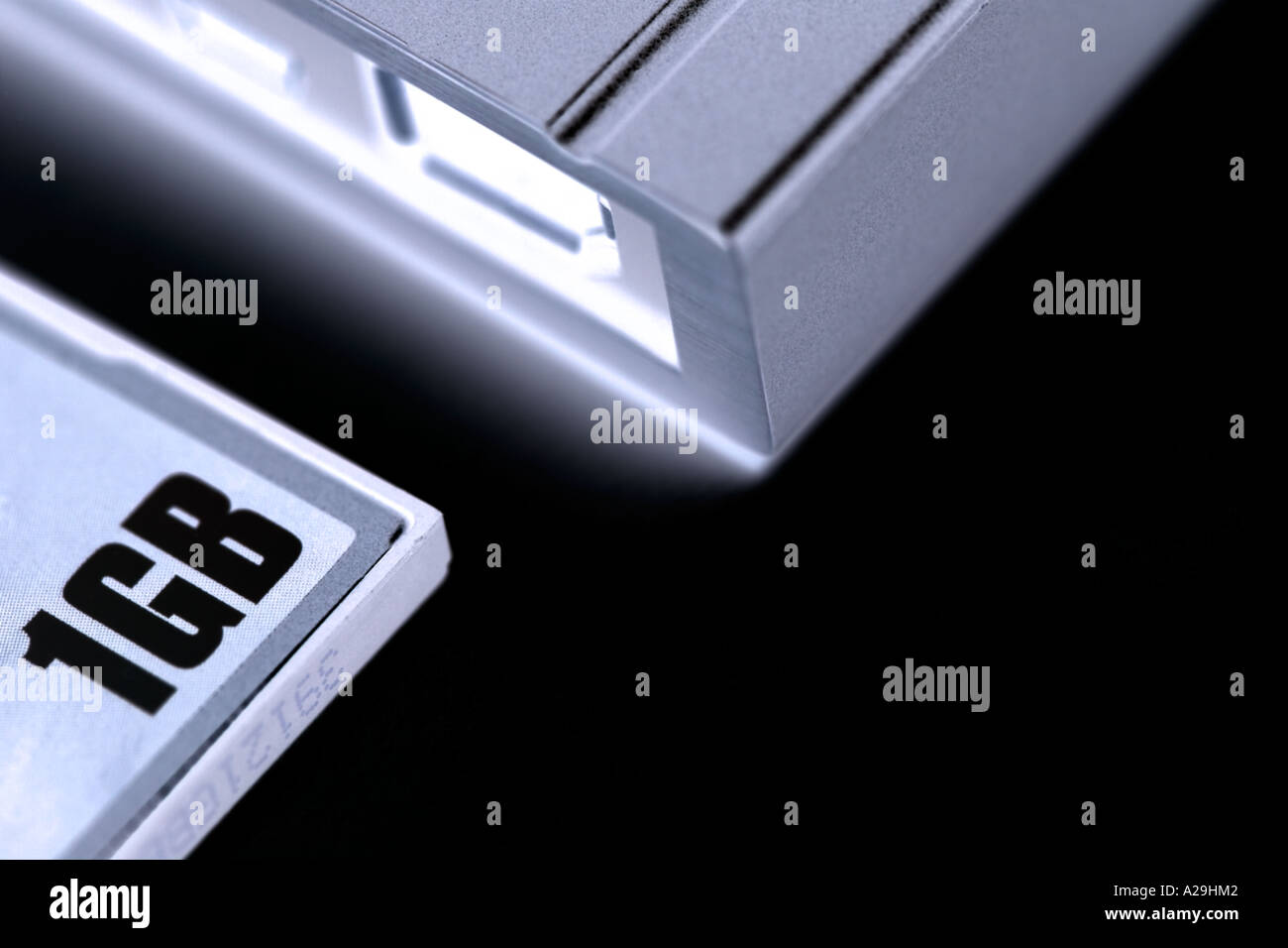 INVERTED MACRO IMAGE OF MEMORY CARD AND PORTABLE HARD DRIVE Stock Photo
