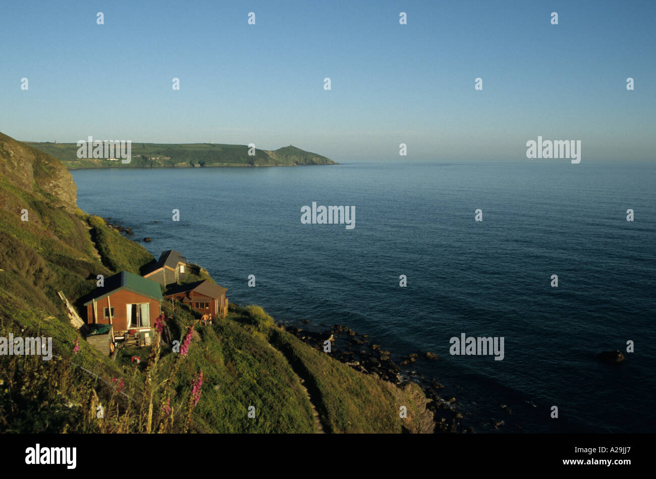 Rame Head on Whitsand Bay with chalets on the foreground Cornwall UK