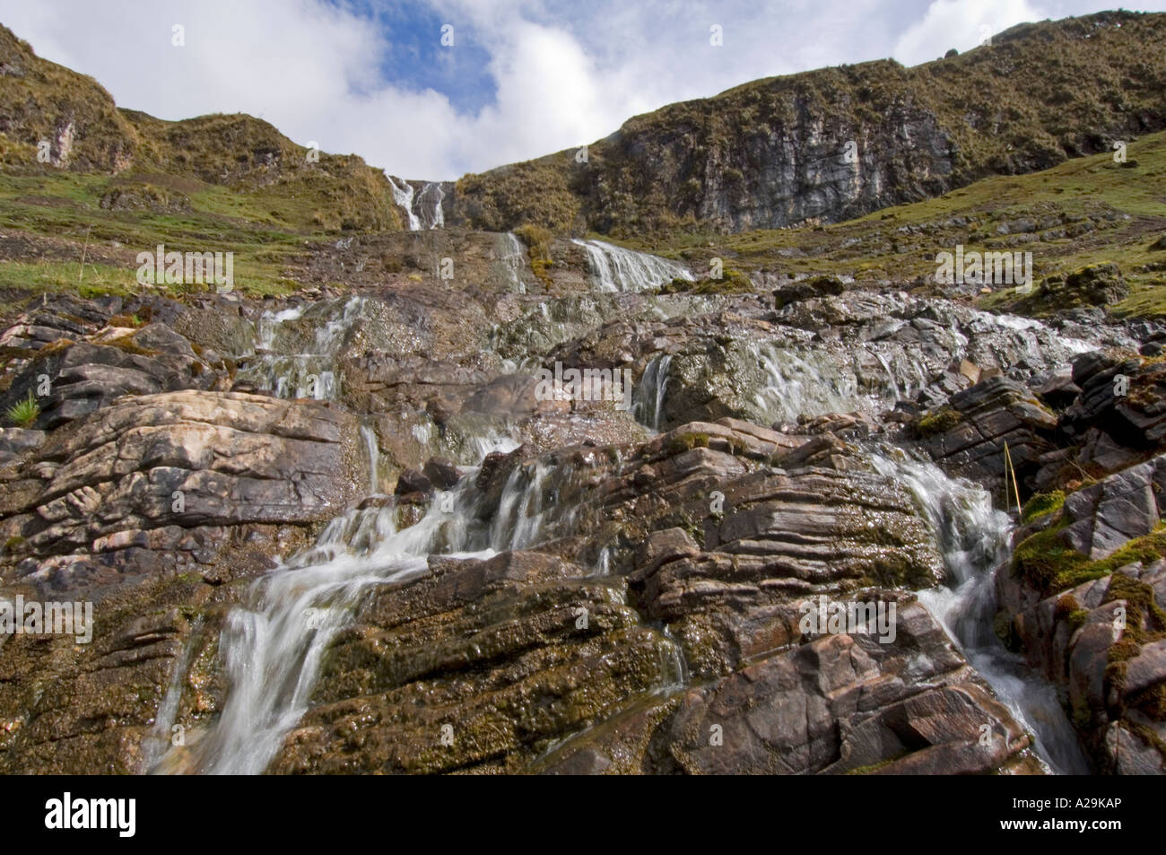 A waterfall and rugged scenery while on the 'community' Inca trail with a slow shutter speed to blur the motion. Stock Photo
