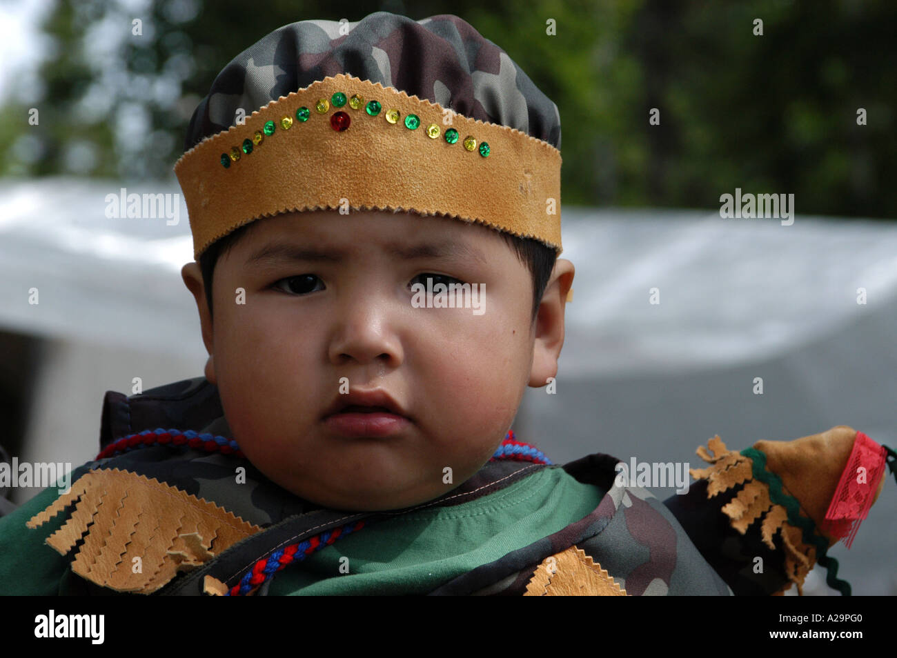 Native cree Baby in traditional costume next to james bay Quebec canada