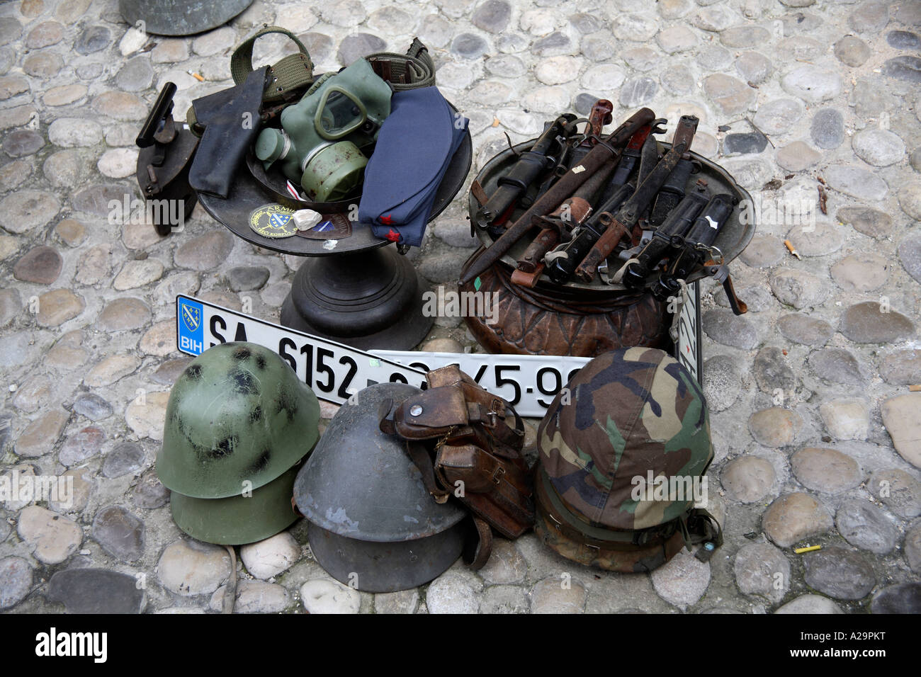 Militaria for sale as souvenirs. Mostar, Bosnia and Hertzegovina, Europe Stock Photo
