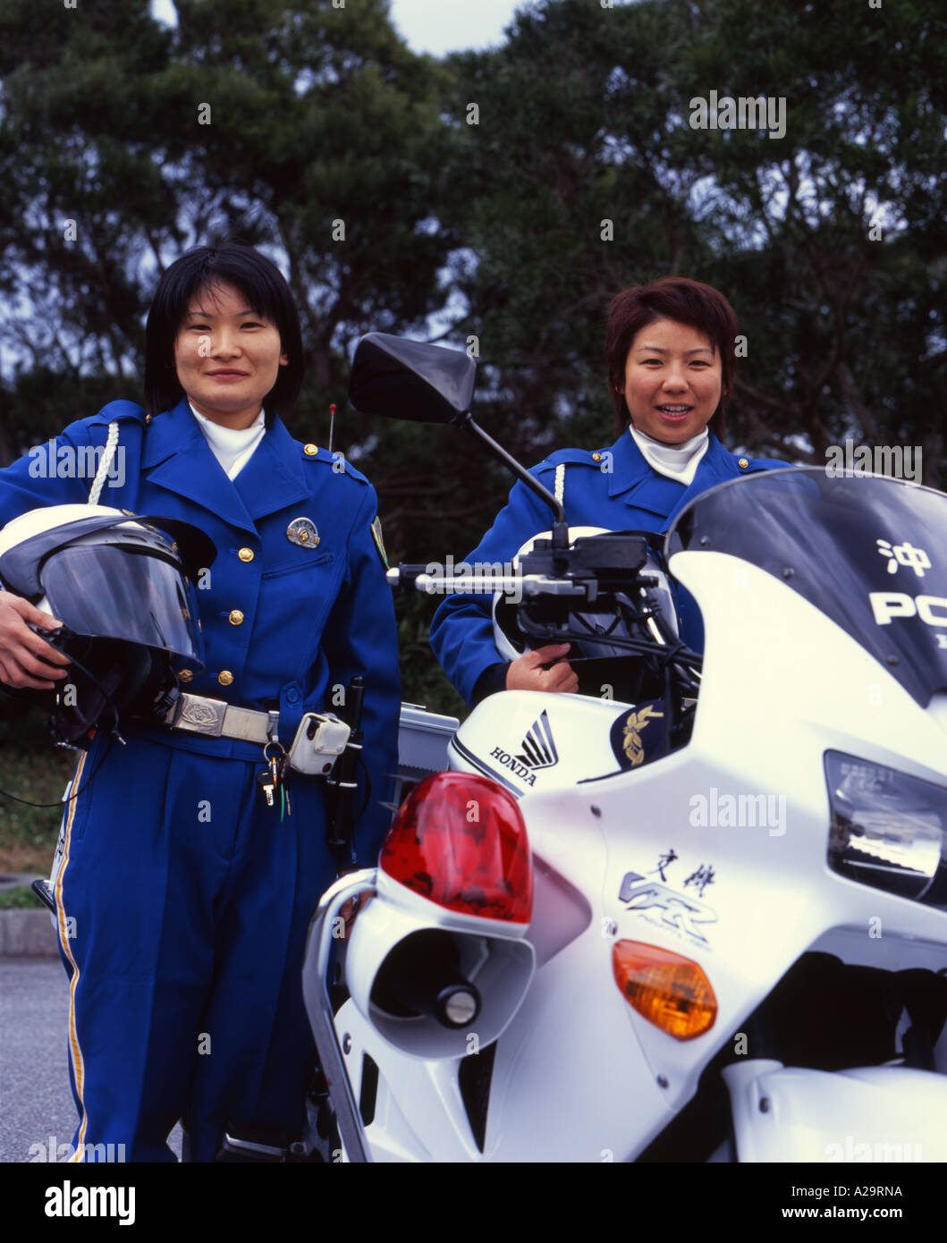 Female Police Motorcycle Officers and their Honda 750cc bike, Okianwa, Japan Stock Photo