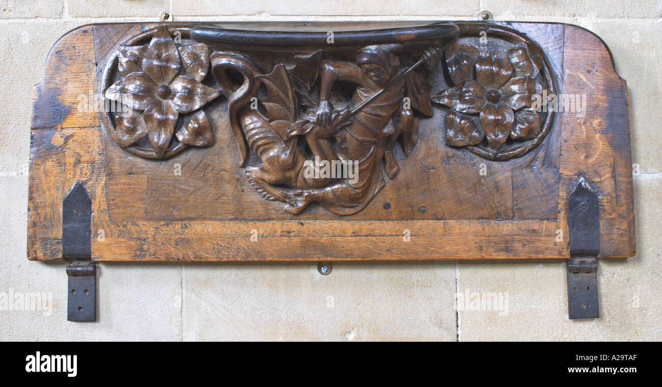 A misericord at Wells Cathedral Shows St Georgre killing the dragon Stock Photo