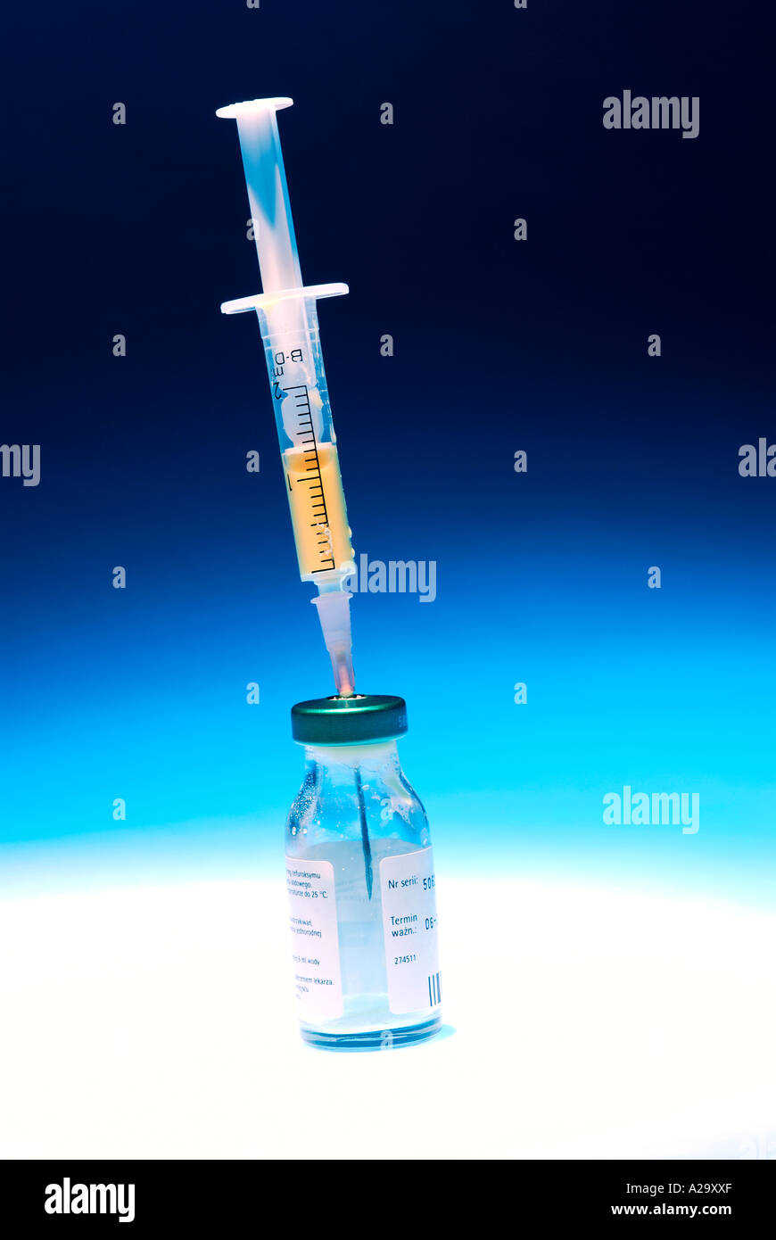 Hypodermic syringe in glass phial, closeup Stock Photo Alamy