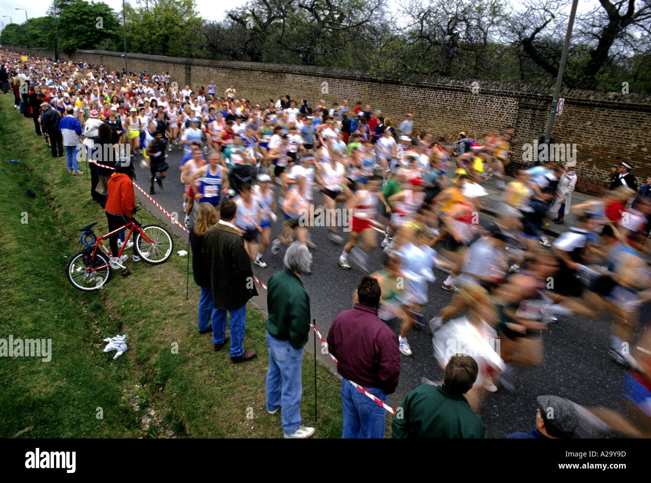 The blur of runners passing spectators in the early stages of the ...