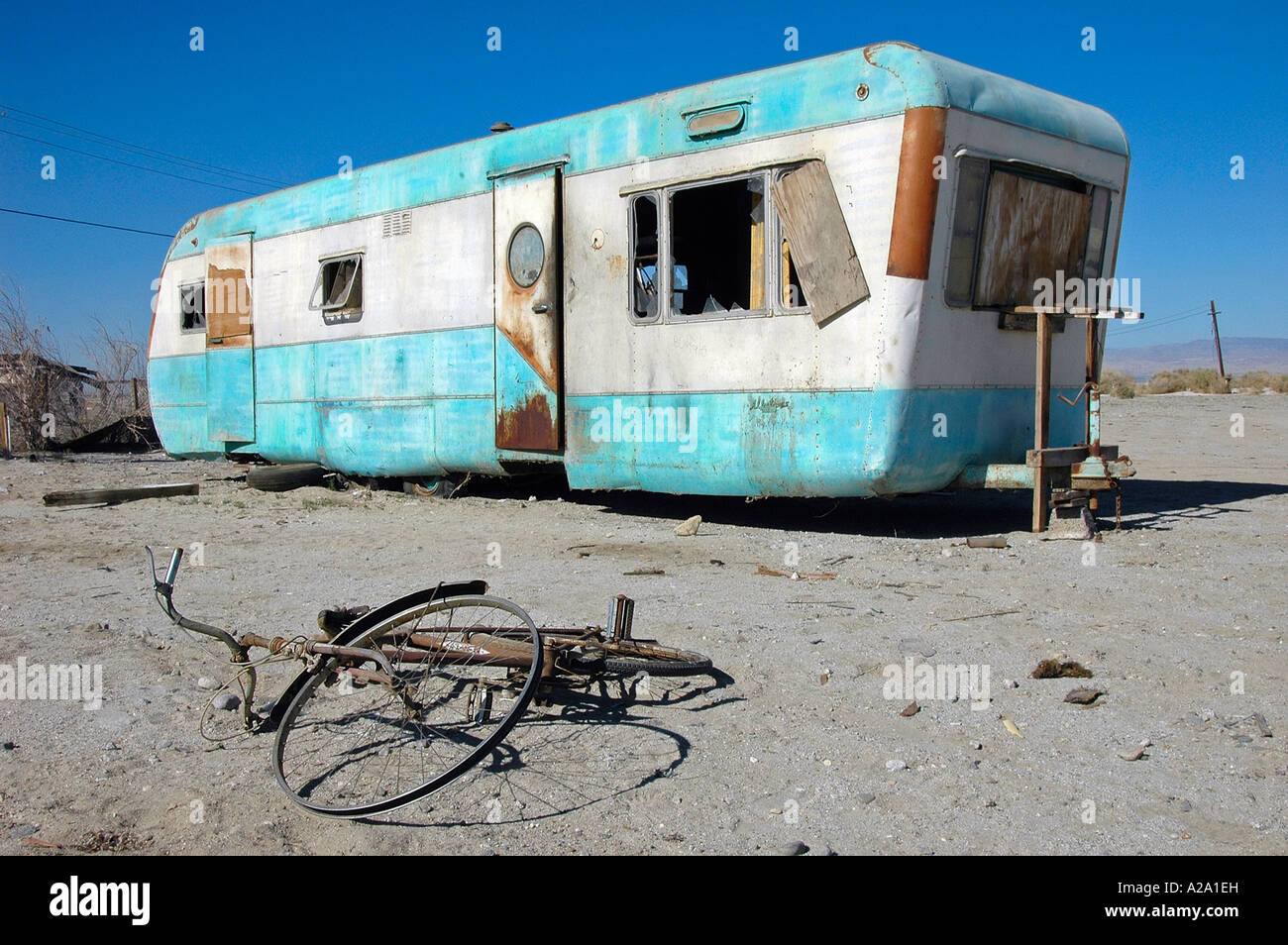 Abandoned mobile home and bicycle on the shores of the Salton Sea