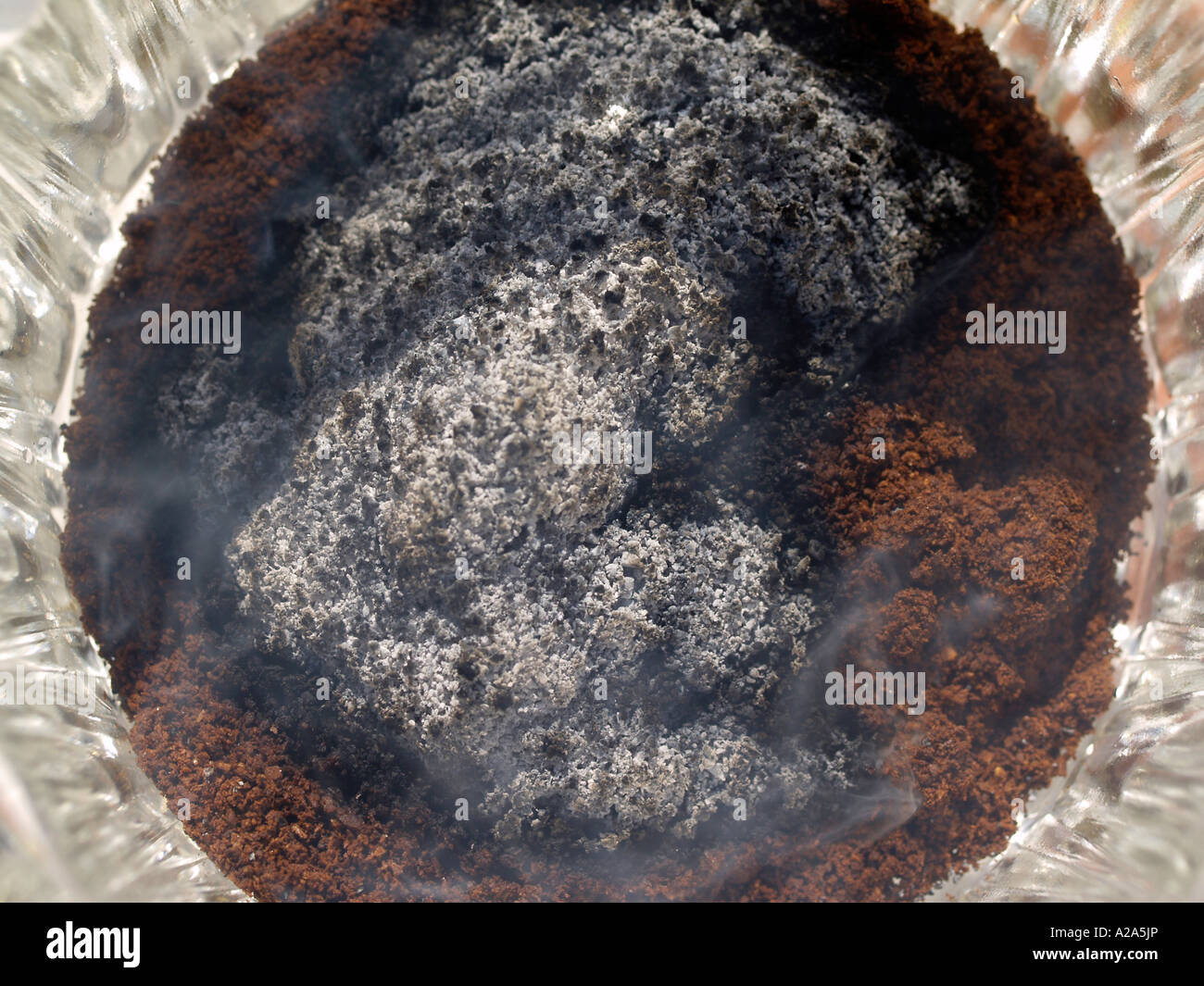 burning coffee to keep insects away Stock Photo Alamy