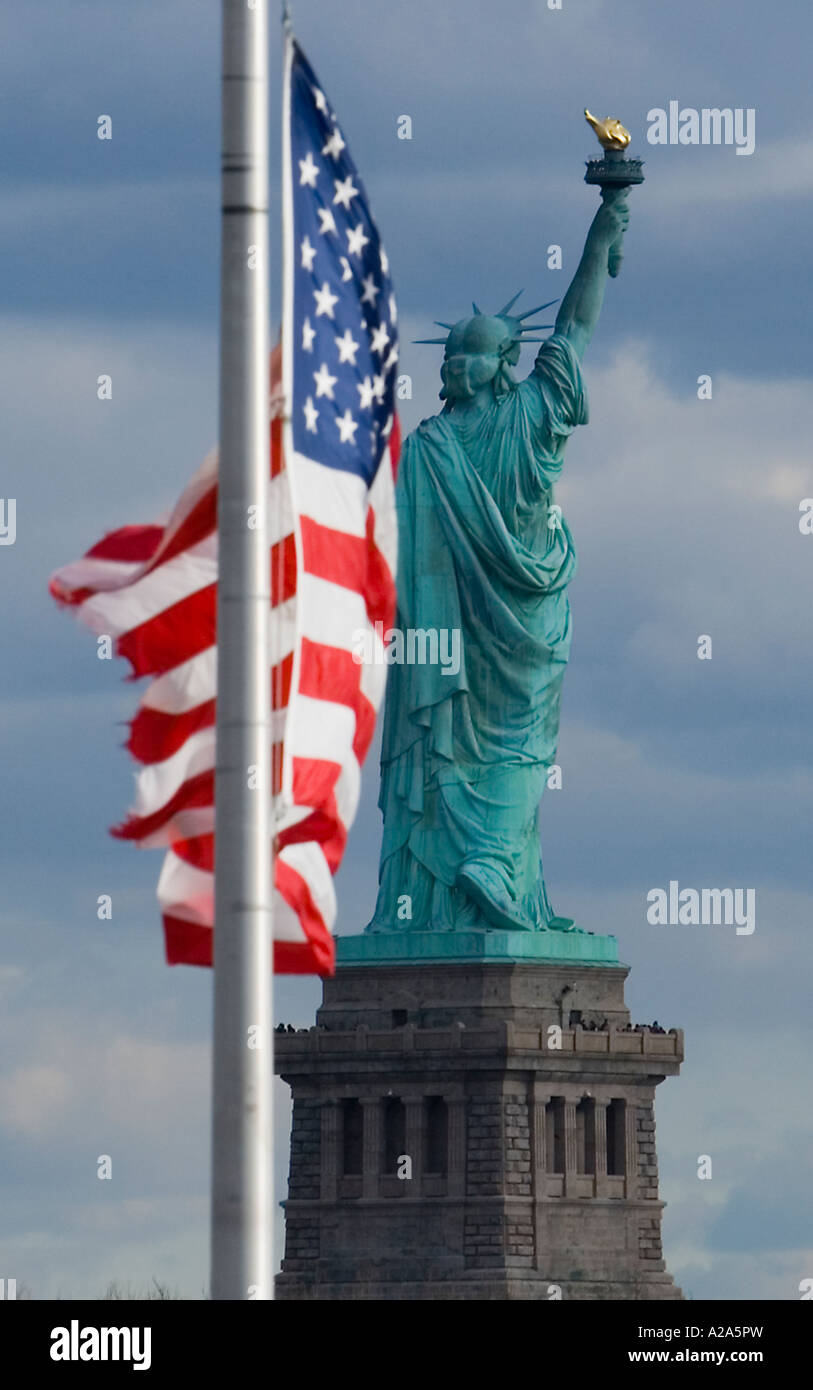 United States flag with the Statue of Liberty in the background Stock ...
