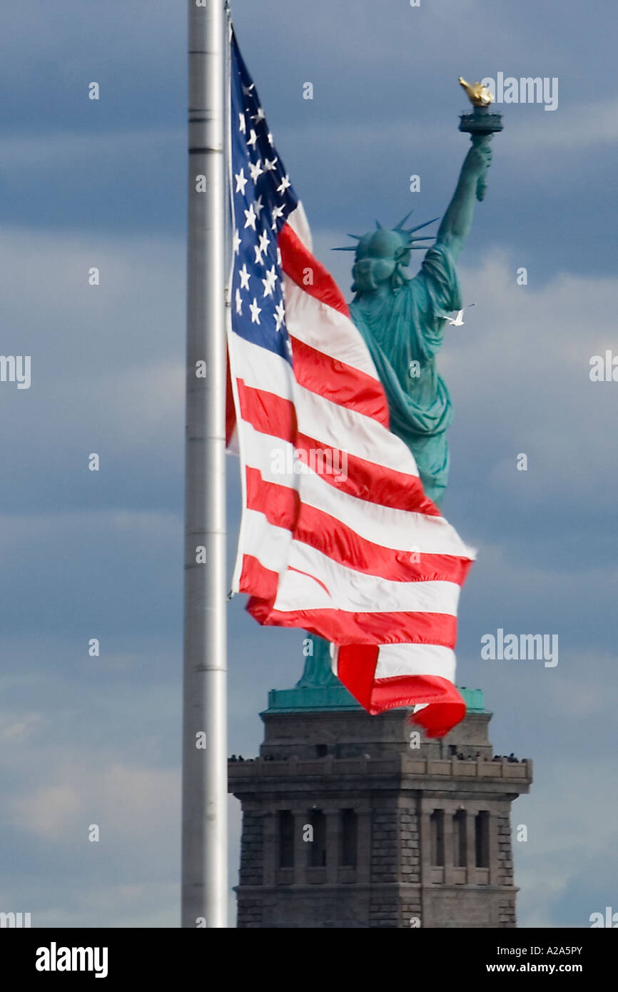 United States flag with the Statue of Liberty in the background Stock ...