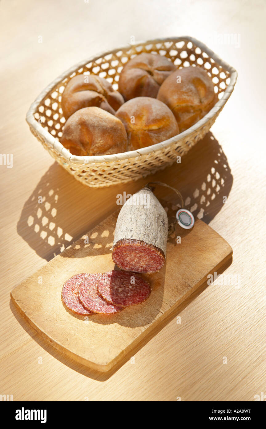 Hungarian salami on a wooden board. Stock Photo