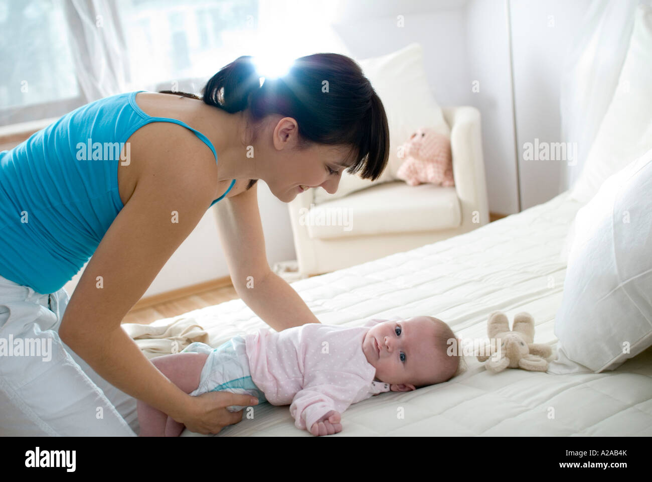 mother changing diaper Stock Photo Alamy