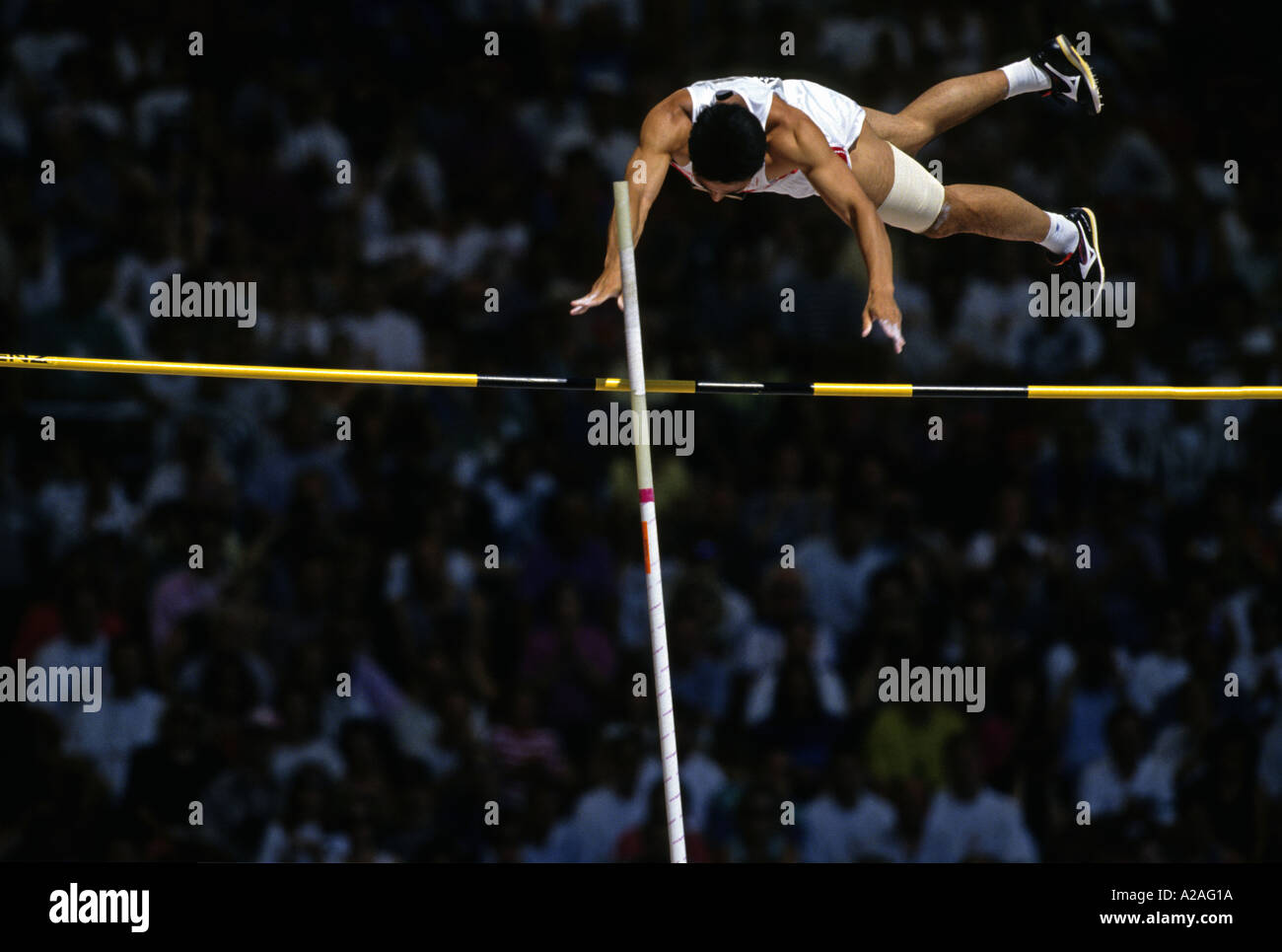 A male athlete clears the bar in the pole vault Stock Photo Alamy