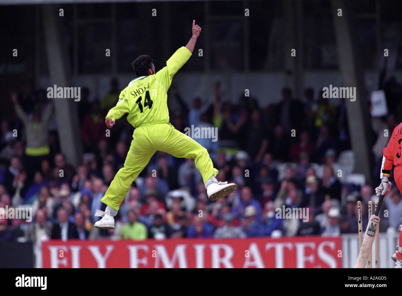 Pakistan bowler Shoaib Akhtar leaps into the air in celebration after taking a wicket Stock Photo