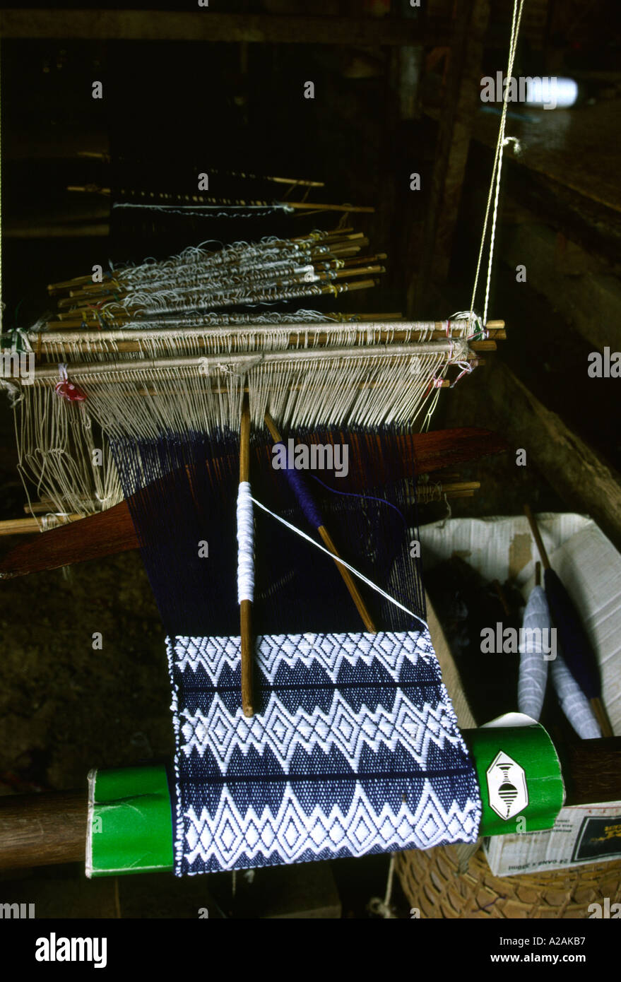 Myanmar Burma Inle Lake Ywama village crafts loom weaving traditional shan fabric Stock Photo
