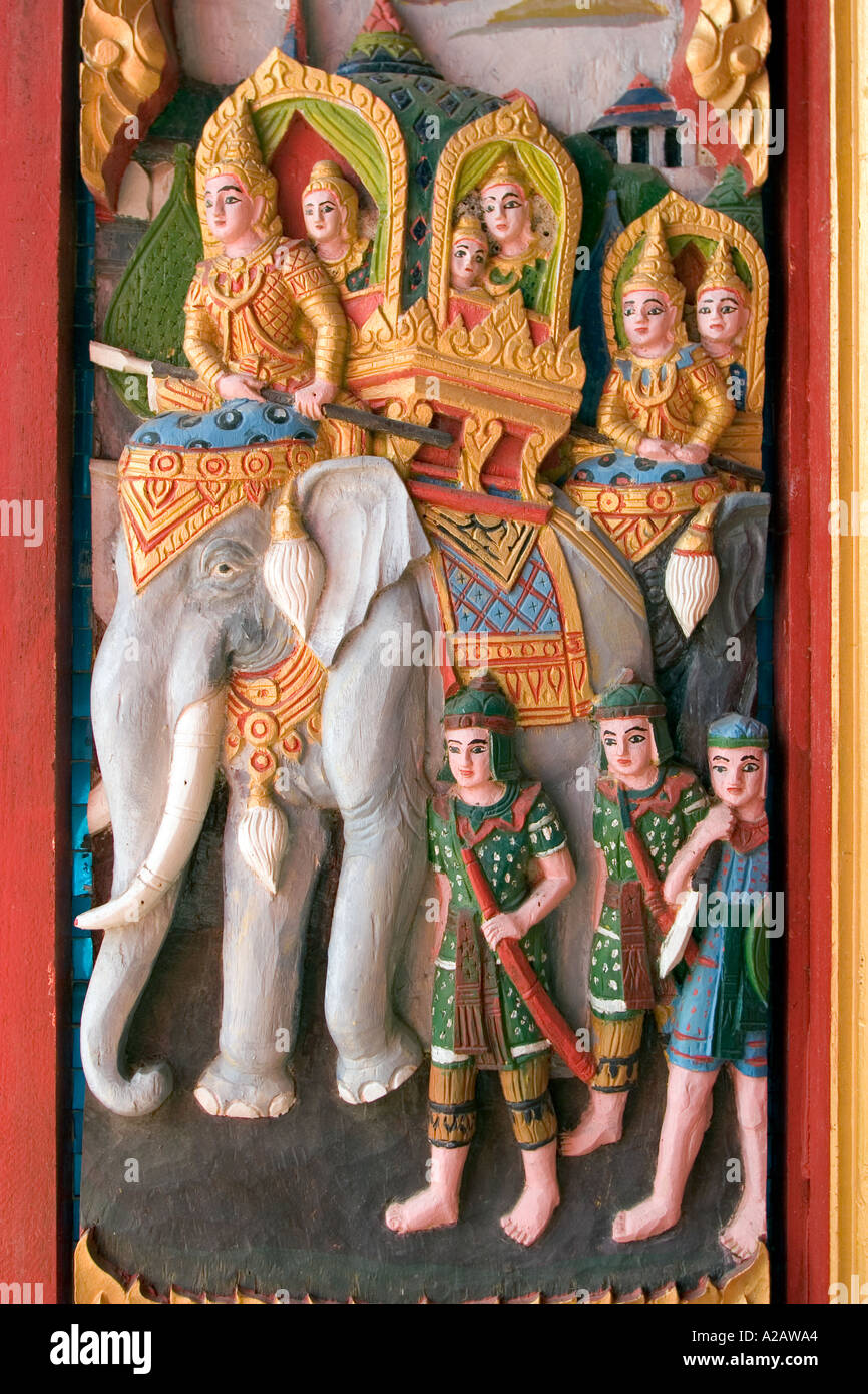 Thailand Ko Samui Religion Buddhism Wat Nuan Naram wood carving of elephant procession on window shutter Stock Photo
