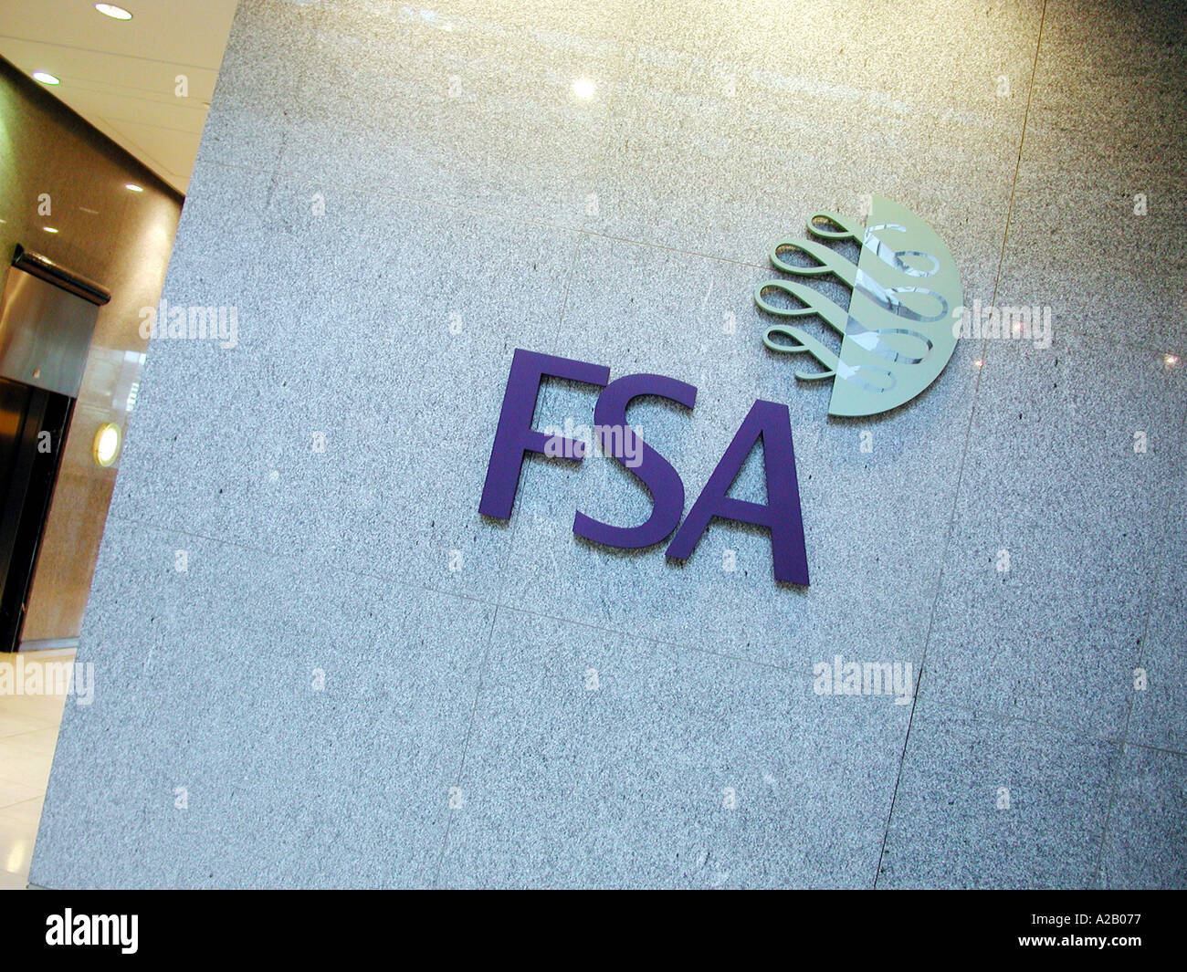 Inside the foyer of the FSA, Financial Services Authority Offices, Canary Wharf, Isle of Dogs, London E14, showing the FSA sign signage and logo. Stock Photo