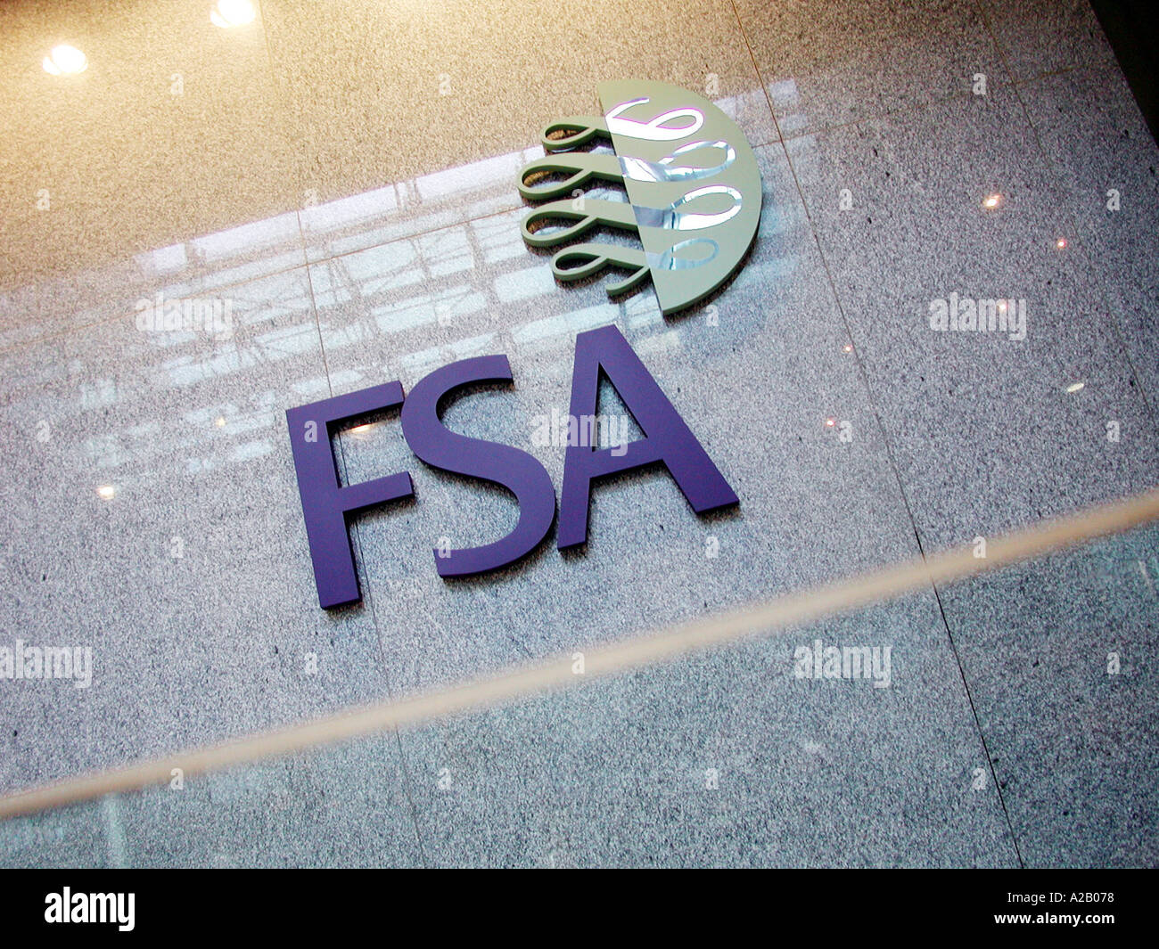 Inside the foyer of the FSA, Financial Services Authority Offices, Canary Wharf, Isle of Dogs, London E14, showing the FSA sign signage and logo. Stock Photo