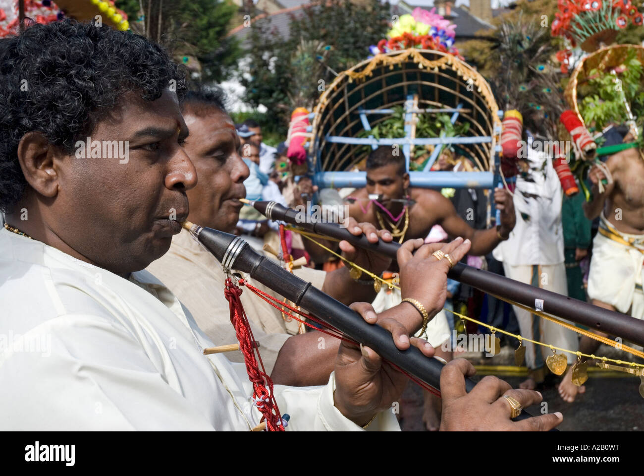 Sri Kanagathurkai Amman Temple Muscians playing for young men performing Kavadi the annual Chariot Festival West Ealing London Stock Photo