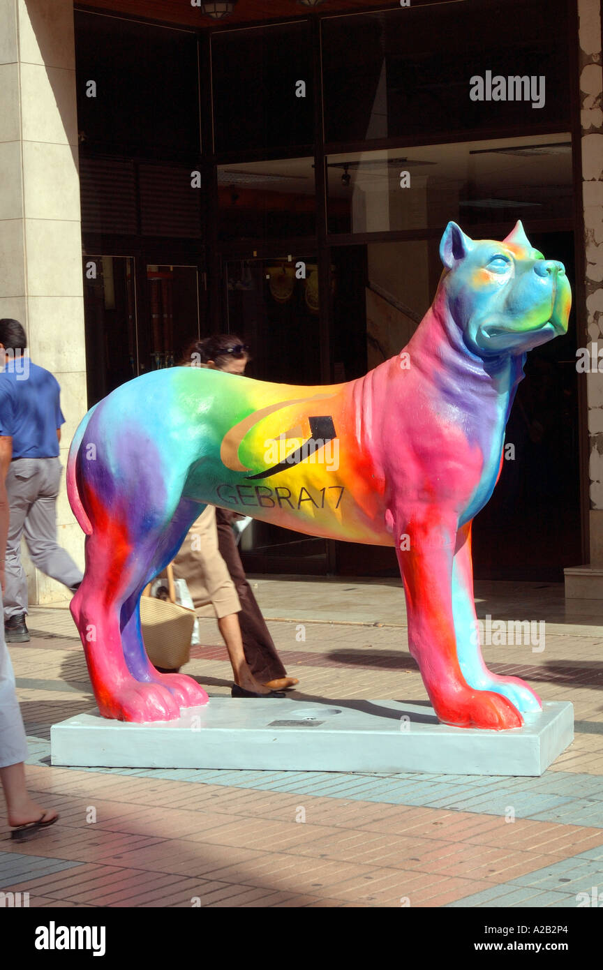 A multi-coloured Canary dog sculpture with passers-by in the background, Las  Palmas de Gran Canaria, Gran Canaria, Canary Island Stock Photo - Alamy