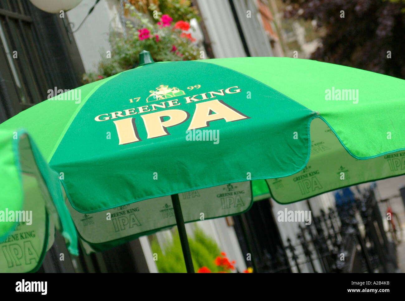 Greene King IPA logo on a parasol in a pub beer garden in London, England, UK Stock Photo