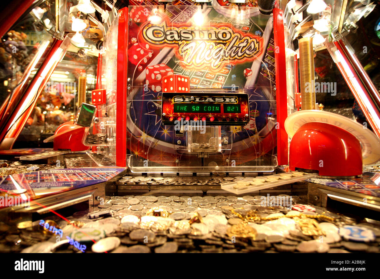 Coin pushing cascade machine in the amusement arcades on Brighton Pier