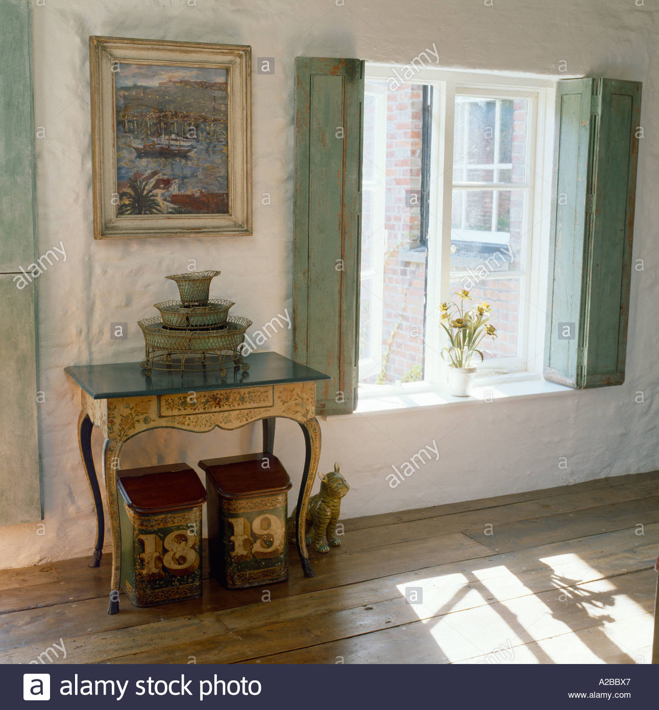 bedroom with french style interior windows with shutters stock photo