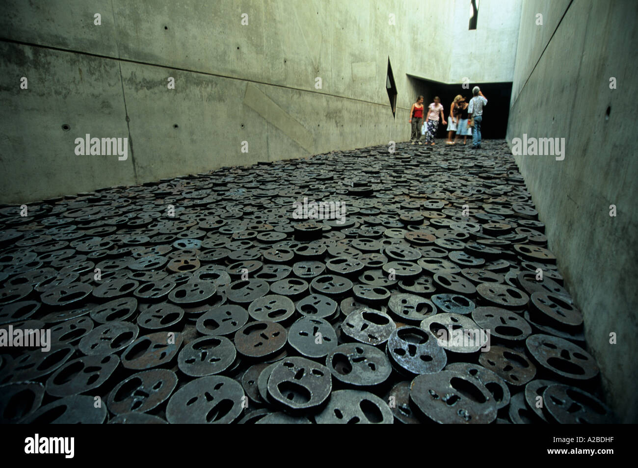 Walking on iron faces of memory void Jewish Museum Berlin Germany