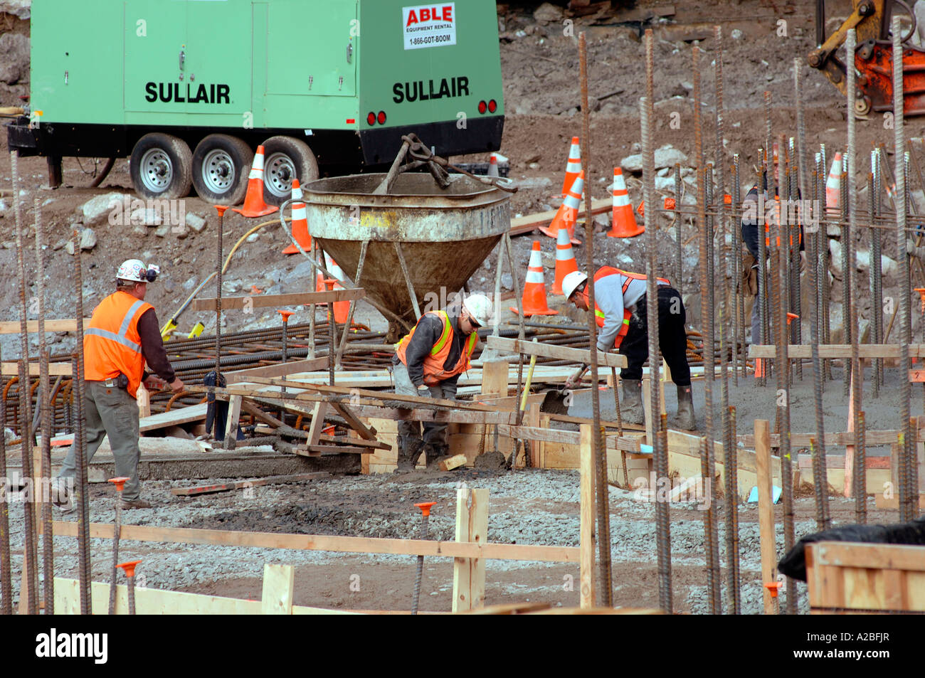Workers pour concrete in Ground Zero for the Freedom Tower foundation