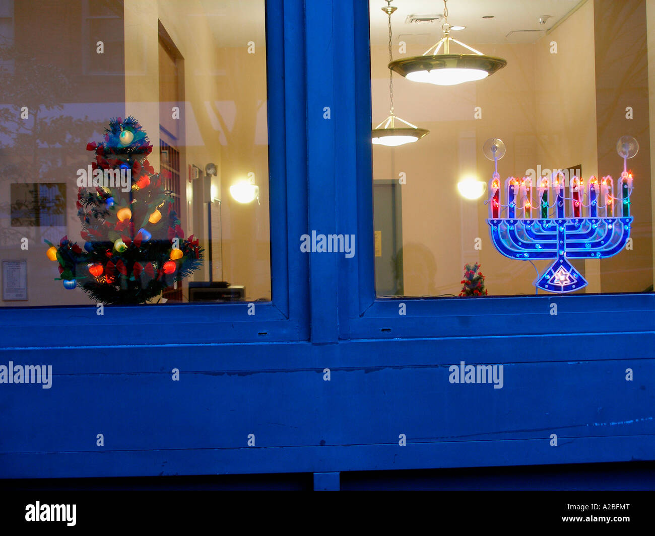 Menorah and Christmas tree in window as holiday display in the Chelsea