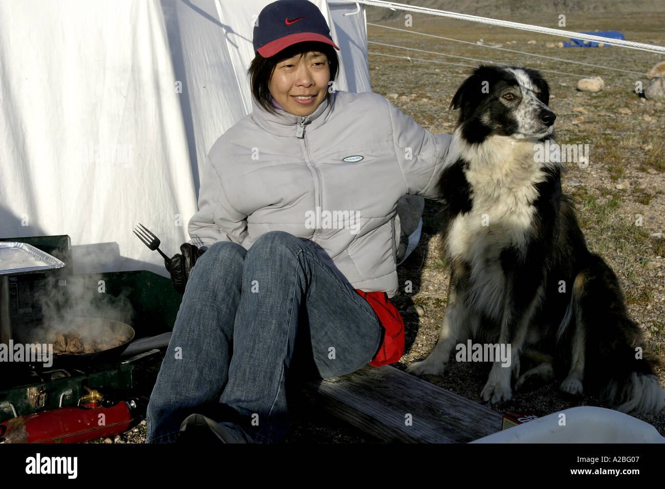Chinese woman cooking at camp York Sound Baffin Island Nunavut Stock