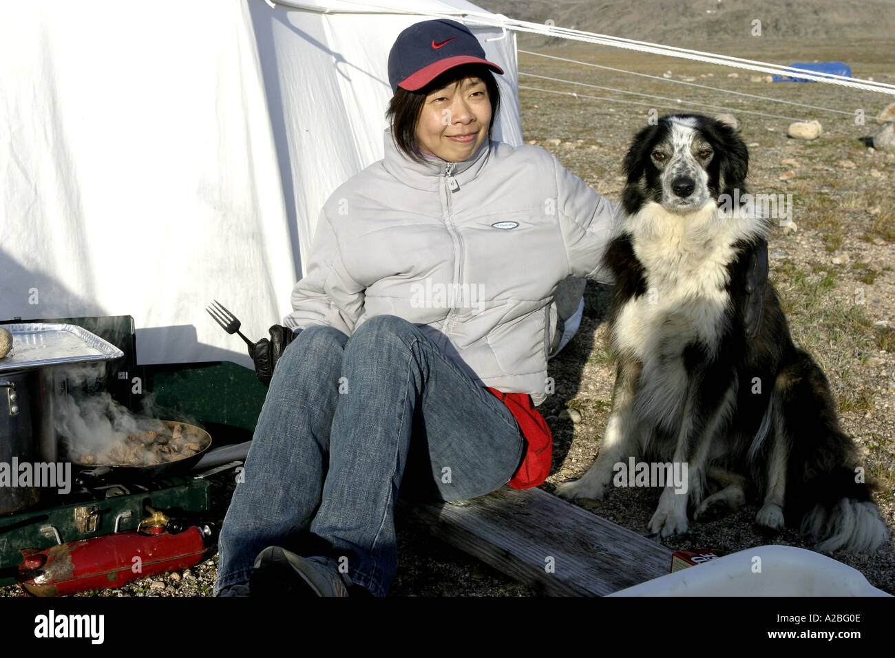 Chinese woman cooking at camp York Sound Baffin Island Nunavut Stock