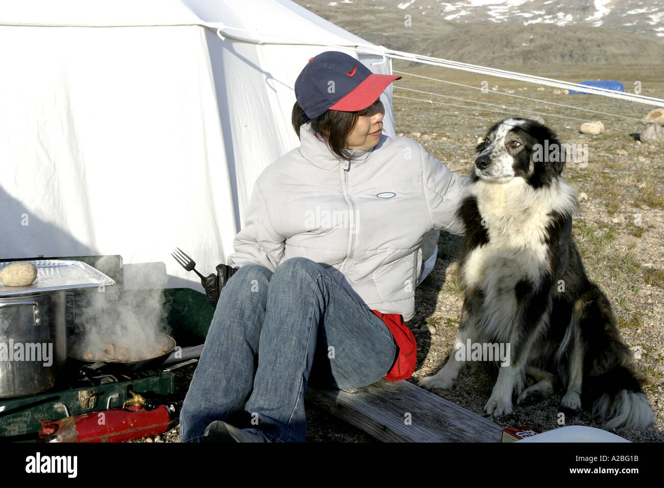 Chinese woman cooking at camp York Sound Baffin Island Nunavut Stock