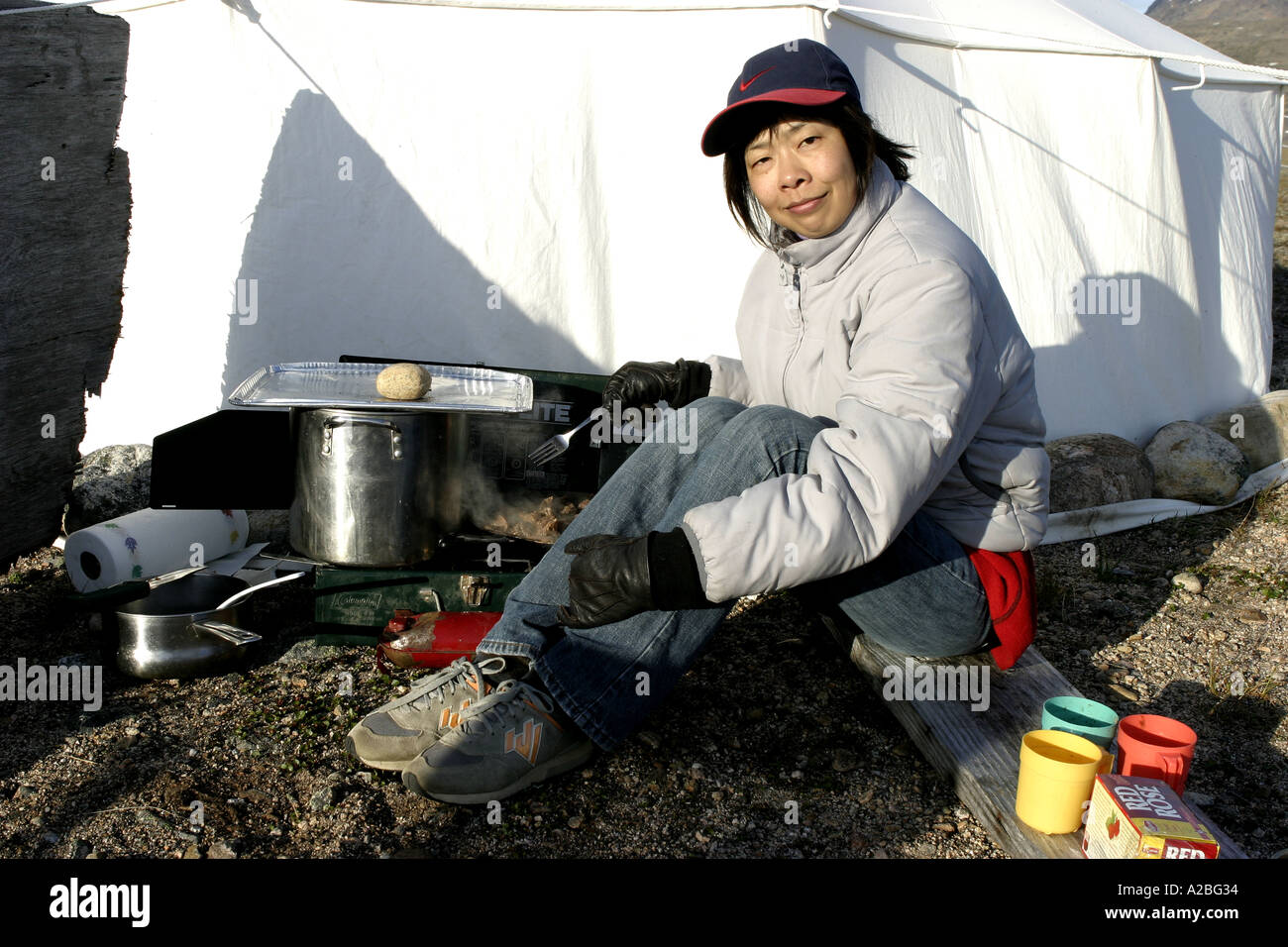 Chinese woman cooking at camp York Sound Baffin Island Nunavut Stock