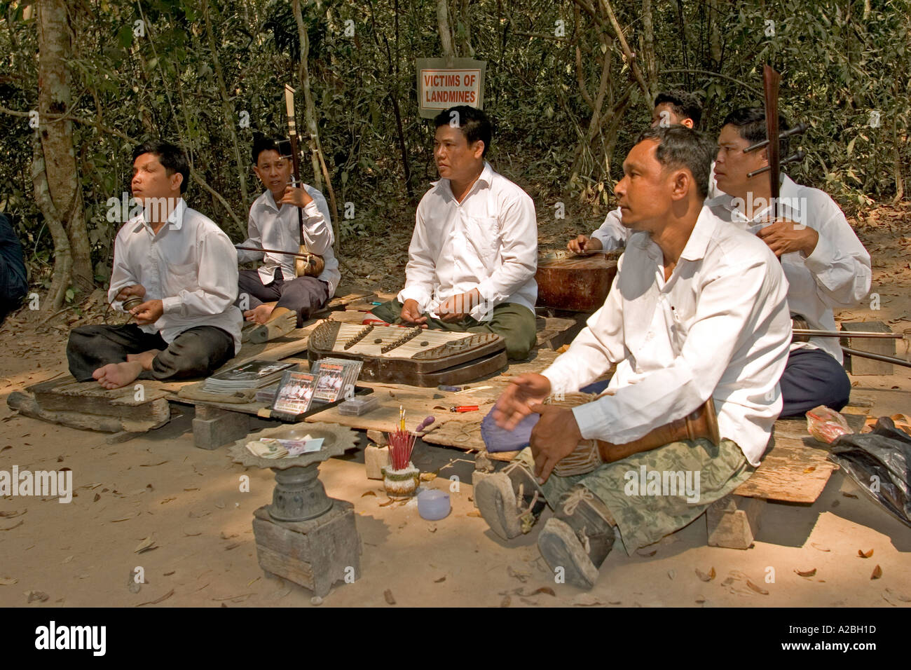 Cambodia Siem Reap Angkor Thom group Ta Prohm musicians injured by land mines performing to tourists for money Stock Photo