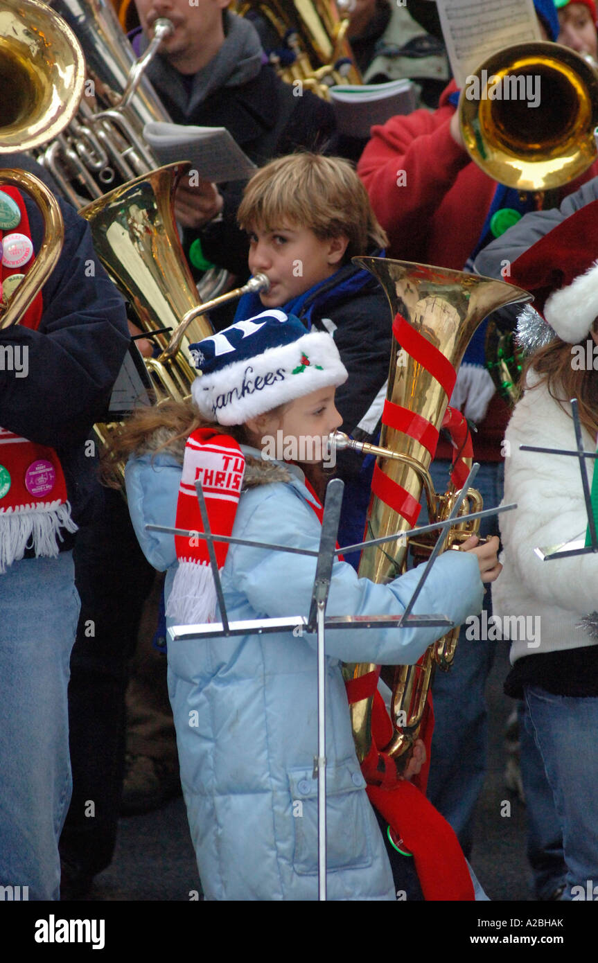 Bass and tenor tuba players gather on the The Rink at Rockefeller