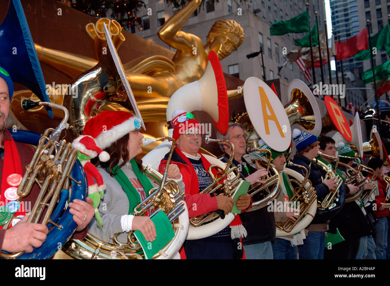 Bass and tenor tuba players gather on the The Rink at Rockefeller Center to perform in the