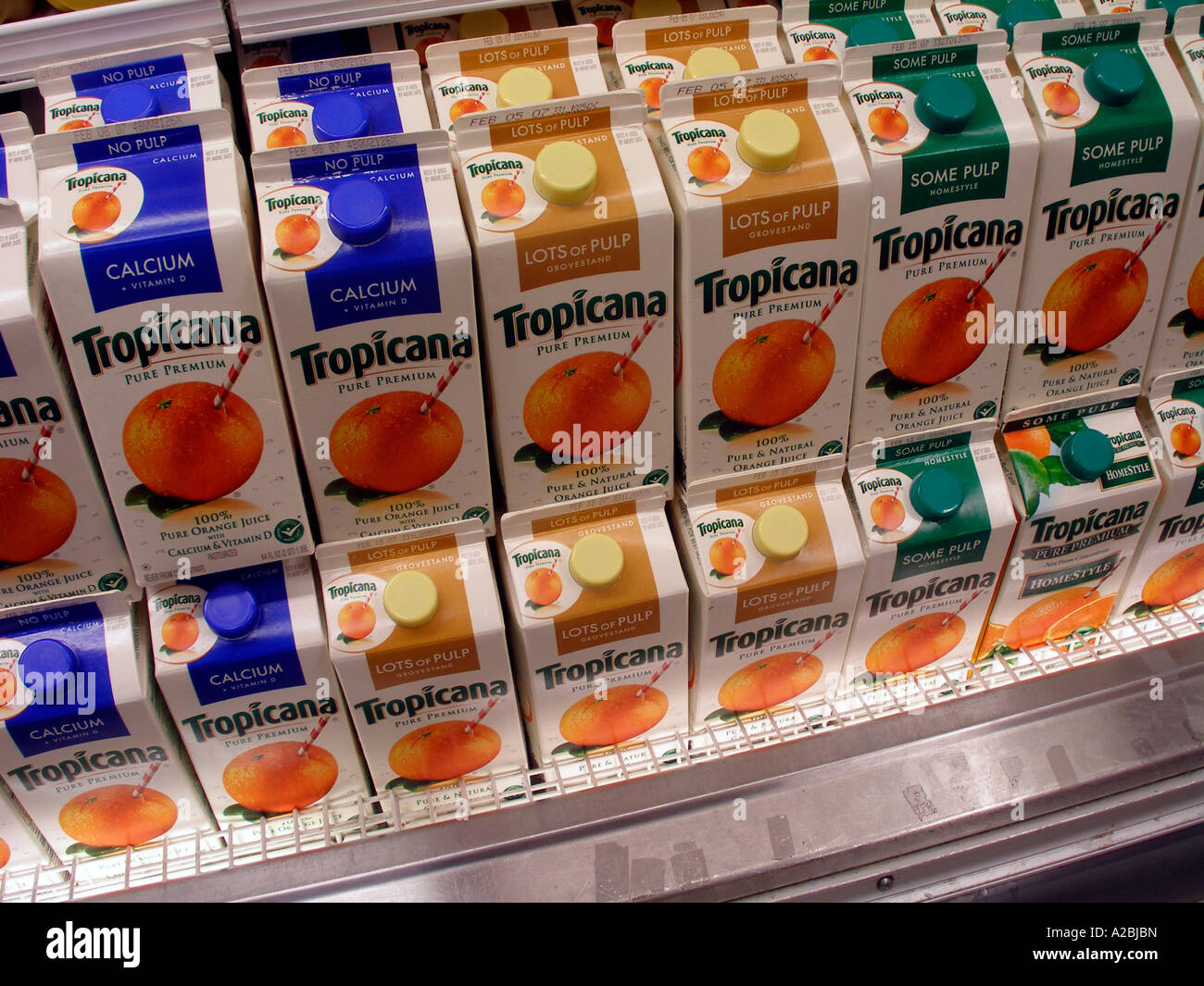 Containers of orange juice on supermarket shelves Stock Photo Alamy