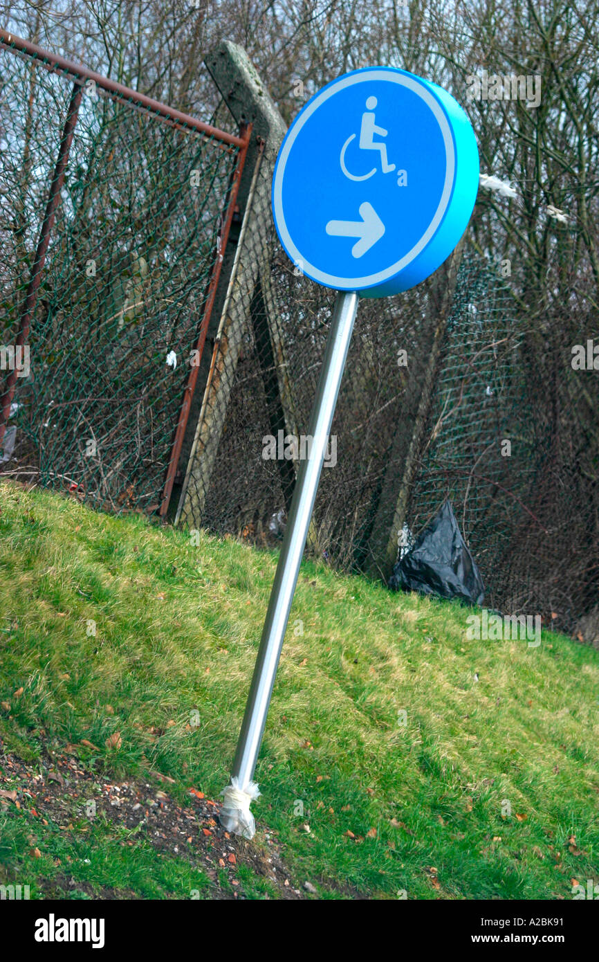 Direction sign to disabled car parking spaces Stock Photo - Alamy
