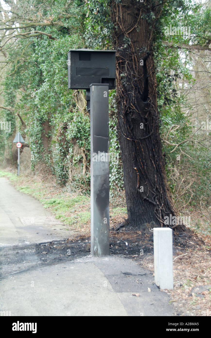 Roadside fixed speed safety camera after being damaged by fire Stock Photo
