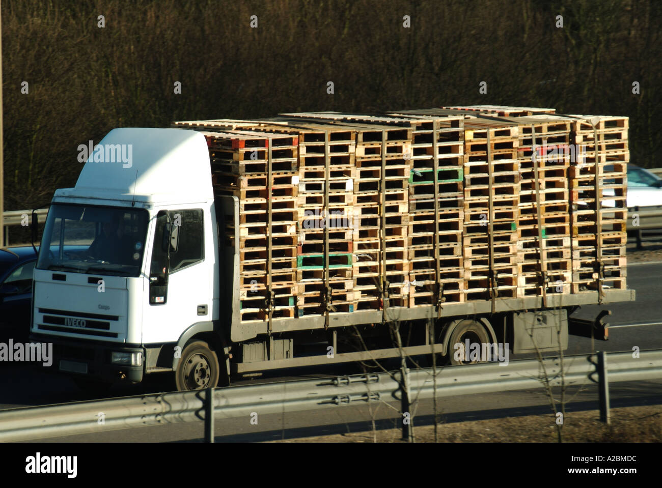Lorry on m25 motorway carrying a load of pallets Stock Photo Alamy